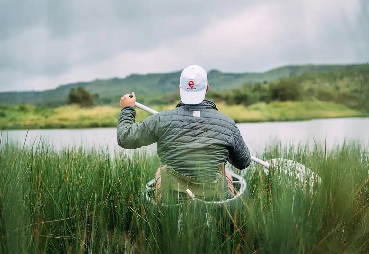 Man in a canoe in the river December
