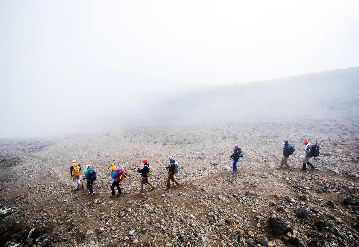 People hiking a rocky path March