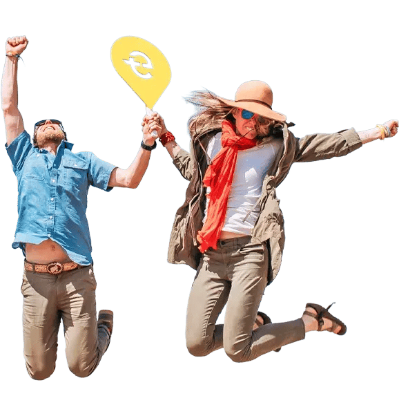 Two people jumping joyfully while holding hands, one holding a yellow sign with Easy Travel symbol